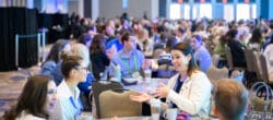 Attendees seated at round tables during a breakout session at the 2025 Points of Light Conference, a leading volunteerism and nonprofit leadership conference focused on civic engagement and cross-sector collaboration.; 2026 nonprofit conferences